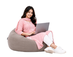 Nepali girl with laptop seating in bean bag png PNG